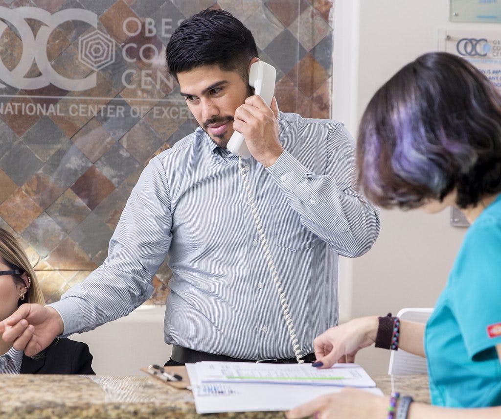 OCC staff member assisting a patient at the Obesity Control Center